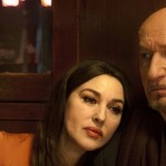 Monica Bellucci leans on Ben Kingsley in the movie A Spider in the Web