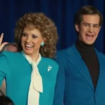 Jessica Chastain waves as Tammy Faye Bakker with Andrew Garfield next to her as Jim Bakker in the film The Eyes of Tammy Faye