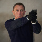Daniel Craig aims his gun in the James Bond movie No Time to Die