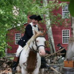 Peter O'Meara rides a horse in a reenactment as Benedict Arnold in the documentary Benedict Arnold: Hero Betrayed