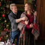 Cary Elwes drapes a blanket around Brooke Shields in the movie A Castle for Christmas