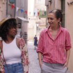 Idella Johnson and Hannah Pepper stroll through a quiet street in the film Ma Belle My Beauty