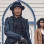 Regina King looks menacing as Zazie Beetz stands behind her in the film The Harder They Fall