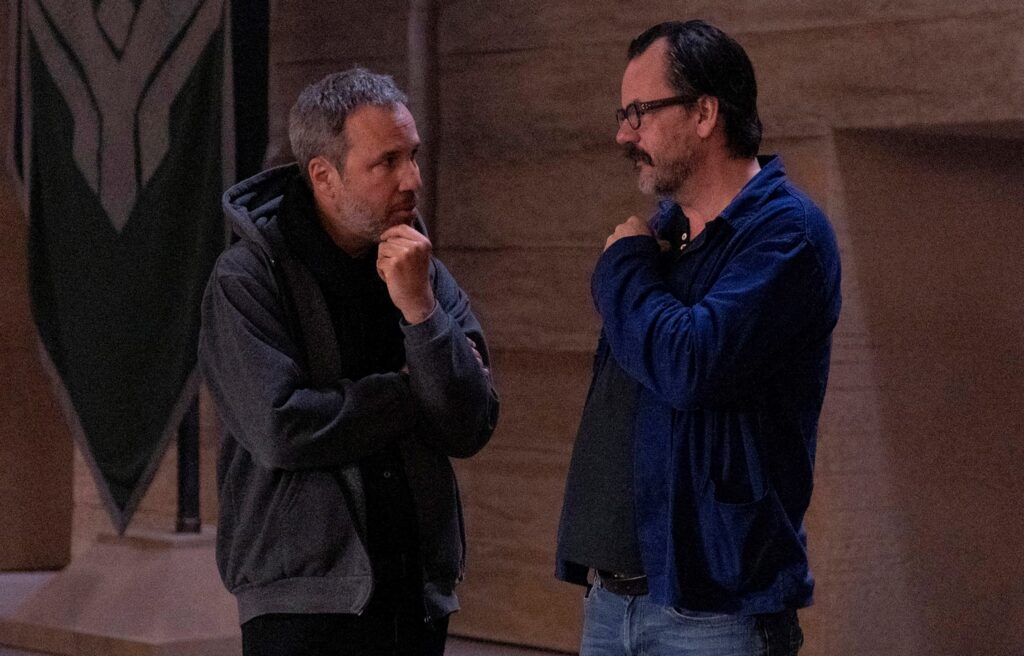 Director Denis Villeneuve talks to editor Joe Walker on the set of Dune