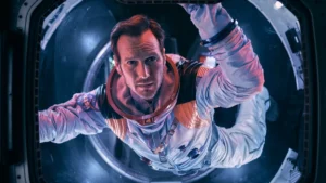 Patrick Wilson floats toward an open hatch in the movie Moonfall