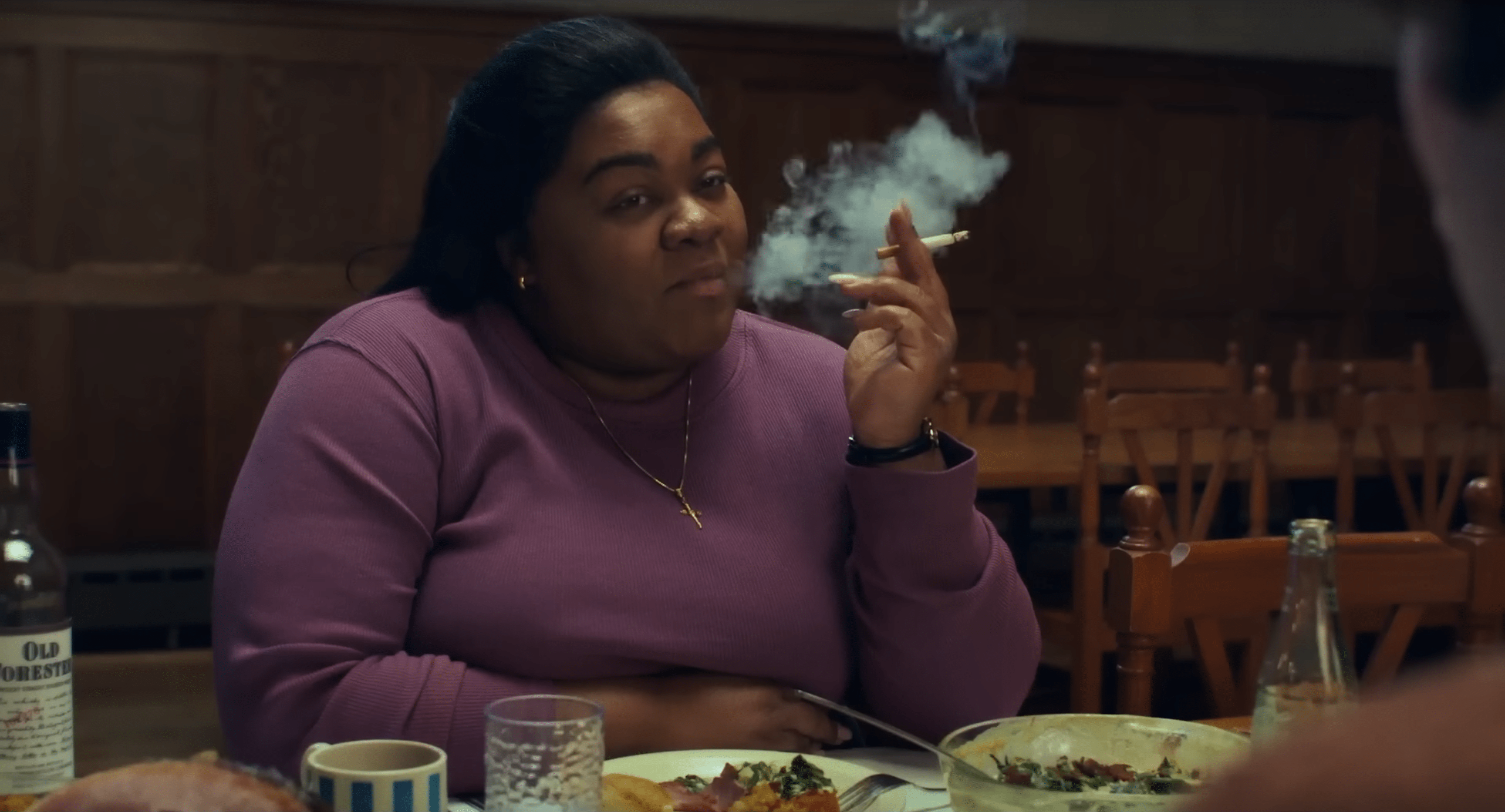 Da'Vine Joy Randolph smokes a cigarette in the movie The Holdovers.