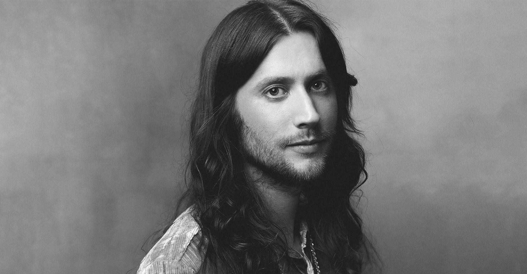 A black and white photo of composer Ludwig Goransson.